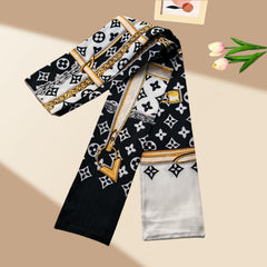 Sophisticated black, white, and gold-toned crepe satin scarf; features a vintage-inspired print and a long, slender silhouette—perfect for styling with shirts or adorning handbags during the spring and summer seasons.
